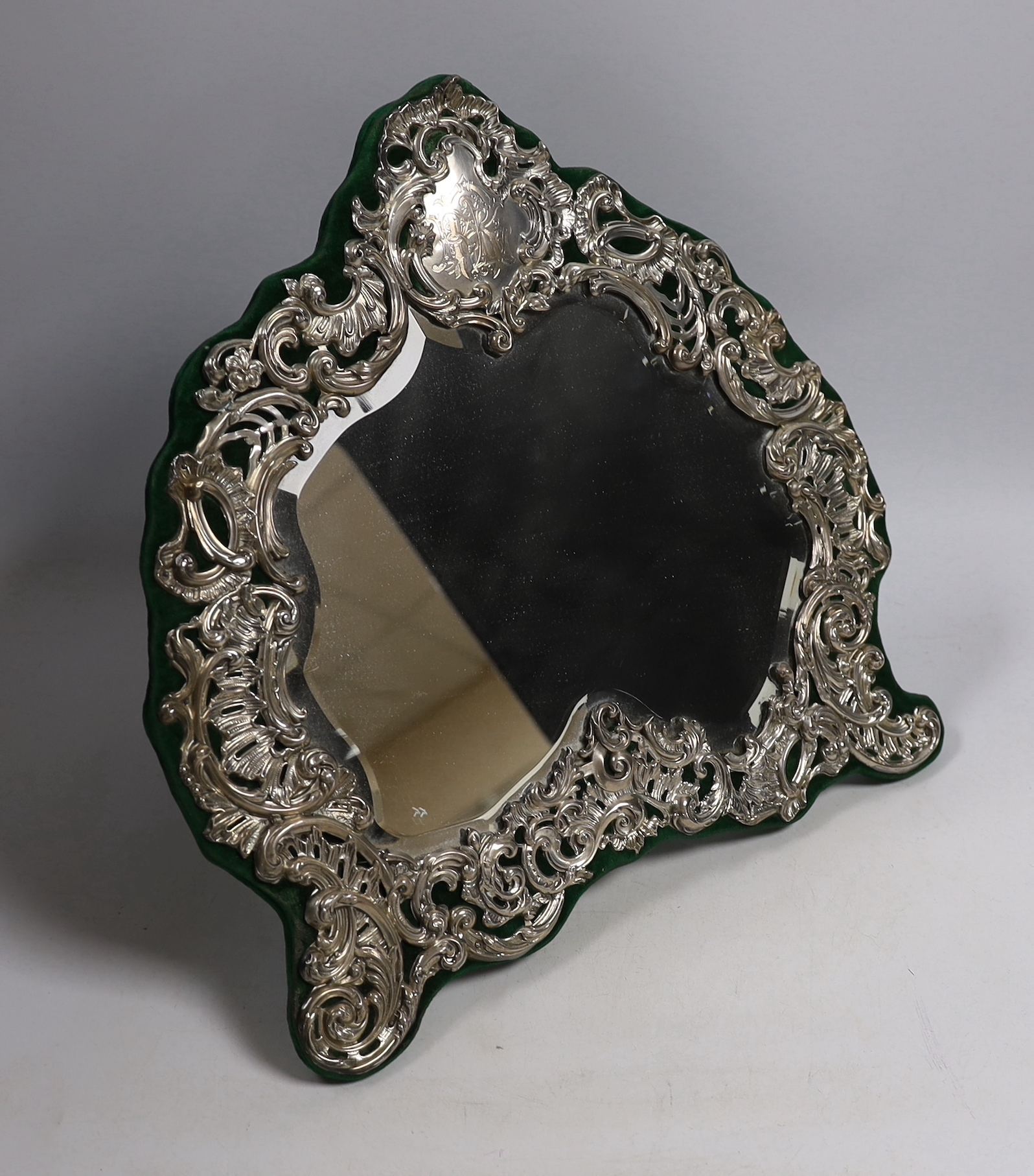 An ornate Edwardian silver mounted easel dressing table mirror, Henry Matthews, Birmingham, 1902, height 35cm.